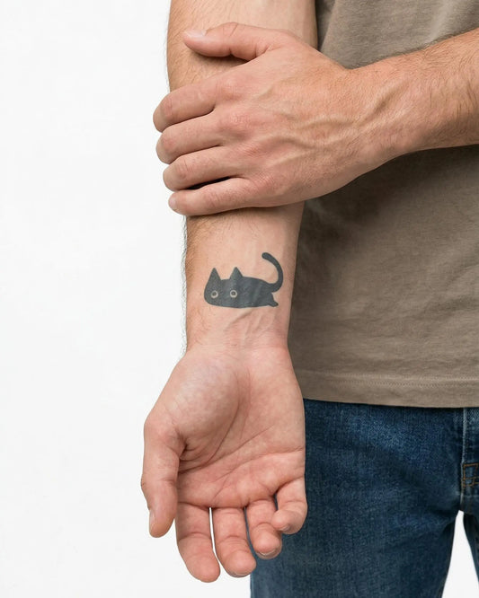INKON Sneaky Cat semi-permanent tattoo applied on a man – 2 x 2 in (5x5cm) design, realistic ink look, lasts 10 days