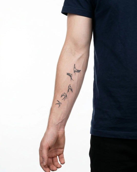 INKON Flying Swallows semi-permanent tattoo applied on a man – 4 x 7 in (10x17cm) design, realistic ink look, lasts 10 days