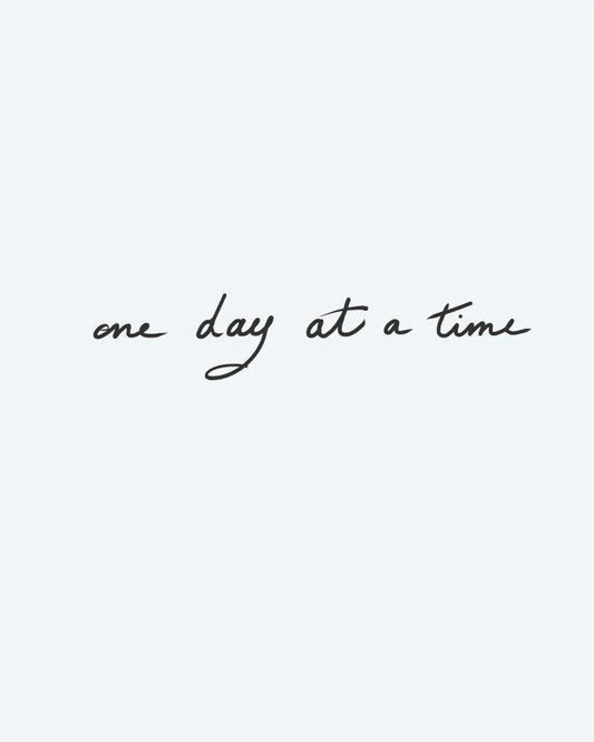 One Day at a Time semi-permanent tattoo design by INKON – handwritten, phrase, time, flowing, cursive illustration, 3 x 4 in (6x11cm), available at inkon.co