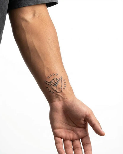 INKON Good Vibes Only semi-permanent tattoo applied on a man – 2 x 2 in (5x5cm) design, realistic ink look, lasts 10 days