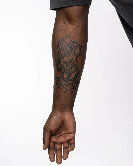 INKON Lucky Ones Praying Hands semi-permanent tattoo applied on a man – 4 x 7 in (10x17cm) design, realistic ink look, lasts 10 days