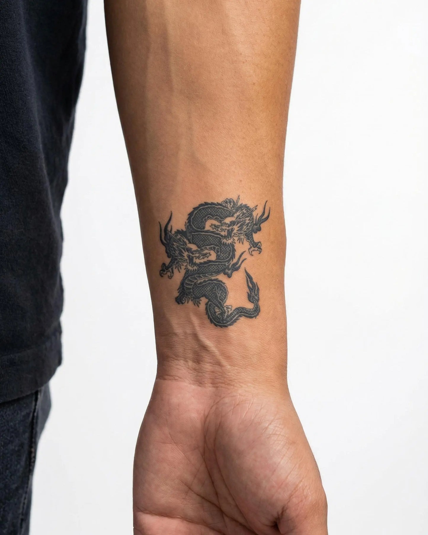 INKON Twin Dragons semi-permanent tattoo applied on a man – 2 x 2 in (5x5cm) design, realistic ink look, lasts 10 days