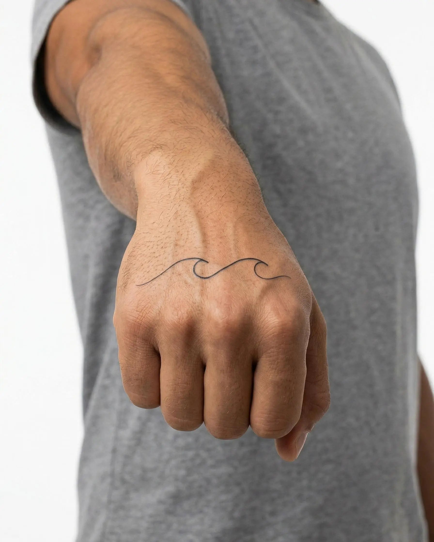 INKON Gentle Waves semi-permanent tattoo applied on a man – 2 x 2 in (5x5cm) design, realistic ink look, lasts 10 days