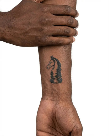 INKON Engraved Chess Knight semi-permanent tattoo applied on a man – 2 x 2 in (5x5cm) design, realistic ink look, lasts 10 days
