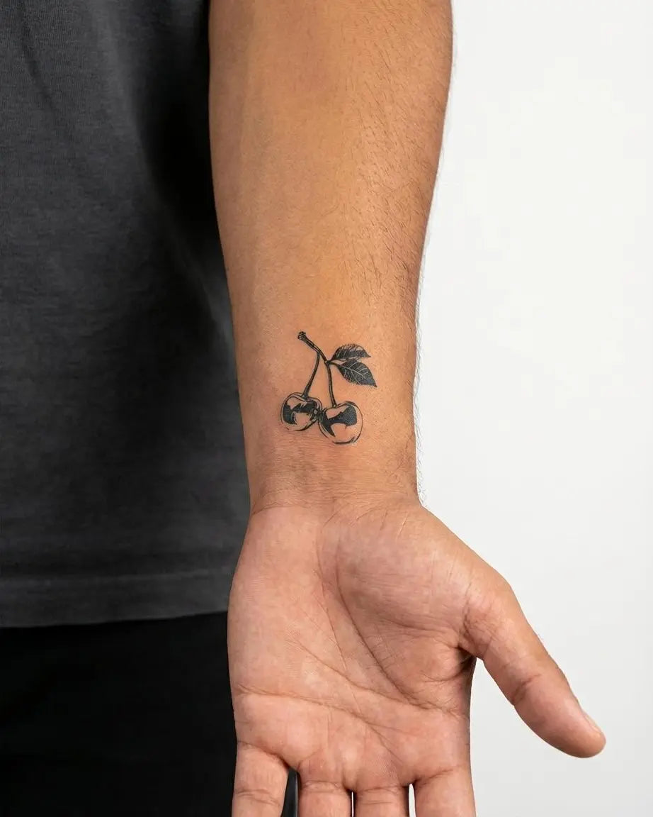 INKON Cherries semi-permanent tattoo applied on a man – 2 x 2 in (5x5cm) design, realistic ink look, lasts 10 days