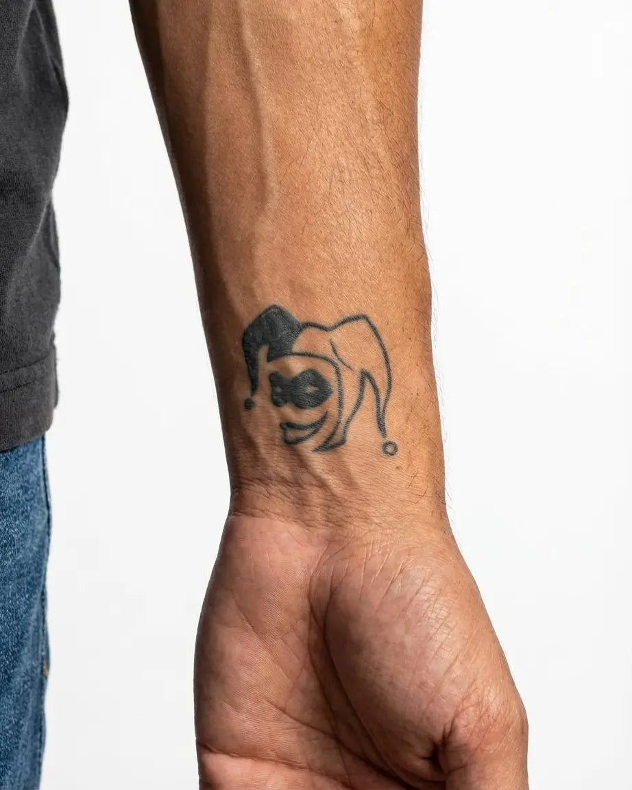 INKON Jester Face semi-permanent tattoo applied on a man – 2 x 2 in (5x5cm) design, realistic ink look, lasts 10 days