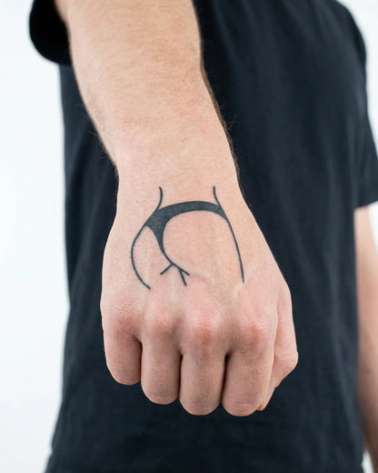 INKON Bikini Line semi-permanent tattoo applied on a man – 2 x 2 in (5x5cm) design, realistic ink look, lasts 10 days