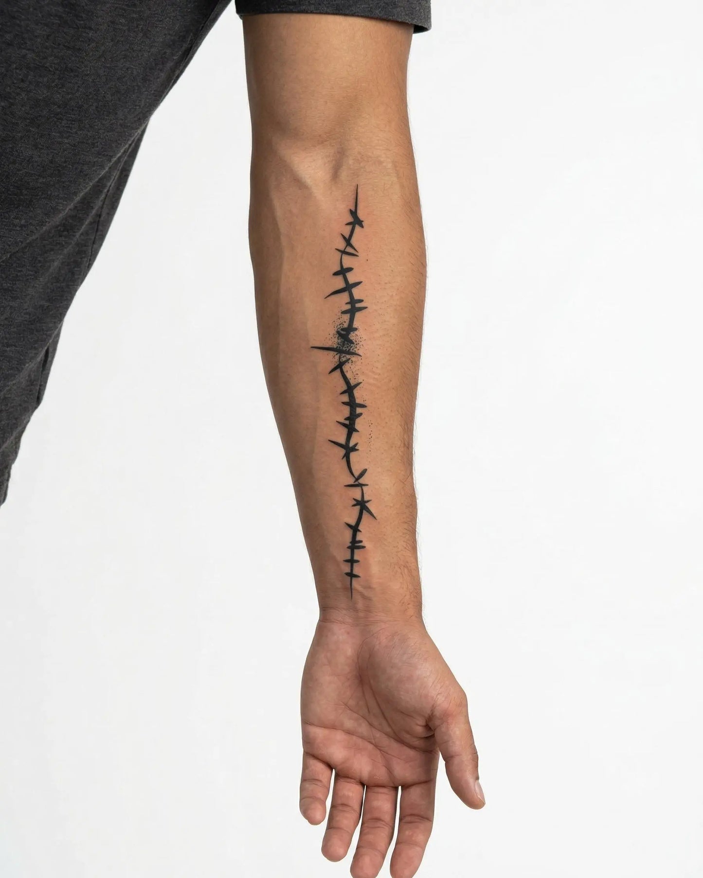 INKON Barbed Wire Line semi-permanent tattoo applied on a man – 4 x 8 in (11x21cm) design, realistic ink look, lasts 10 days