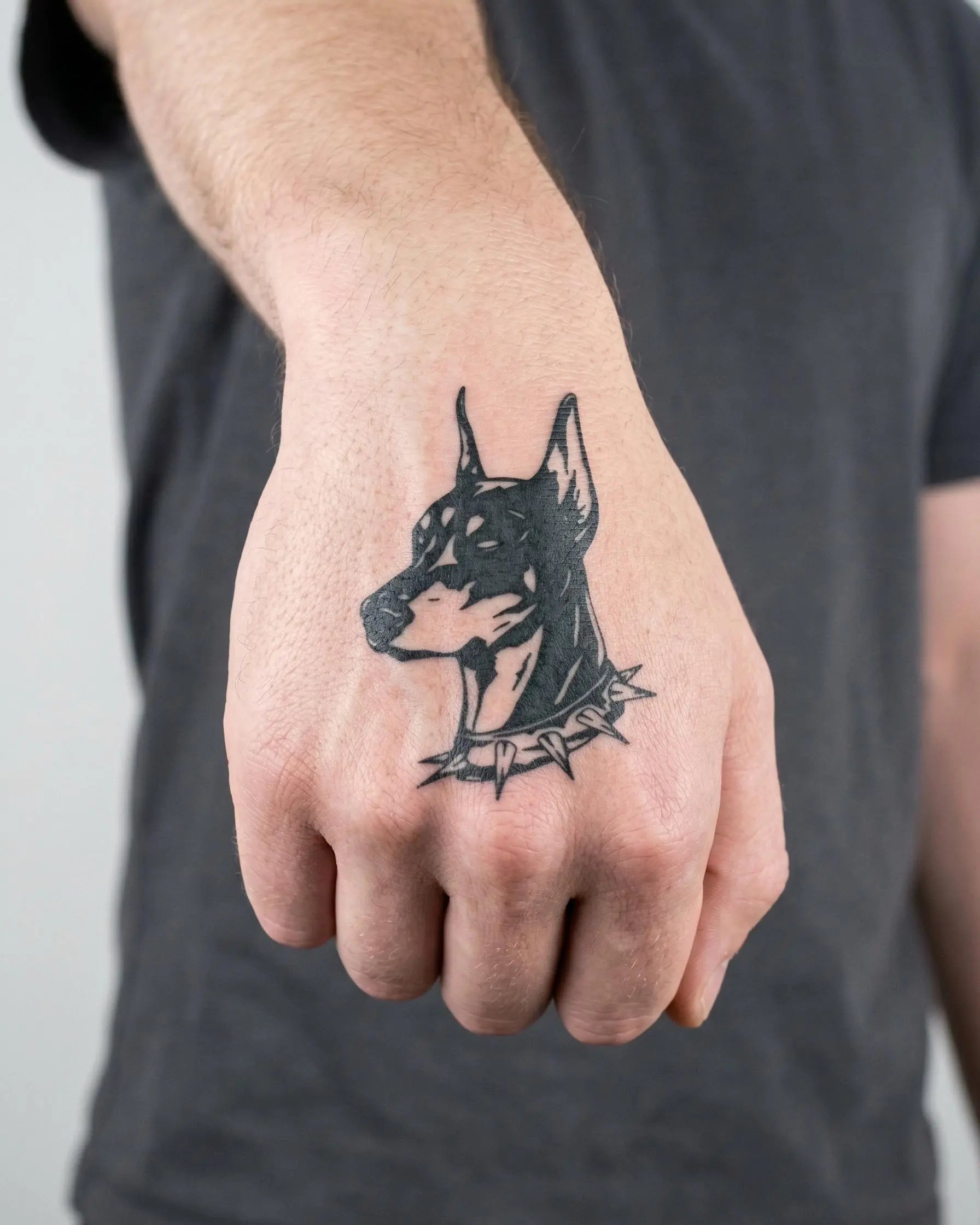 INKON Doberman Portrait semi-permanent tattoo applied on a man – 2 x 2 in (5x5cm) design, realistic ink look, lasts 10 days