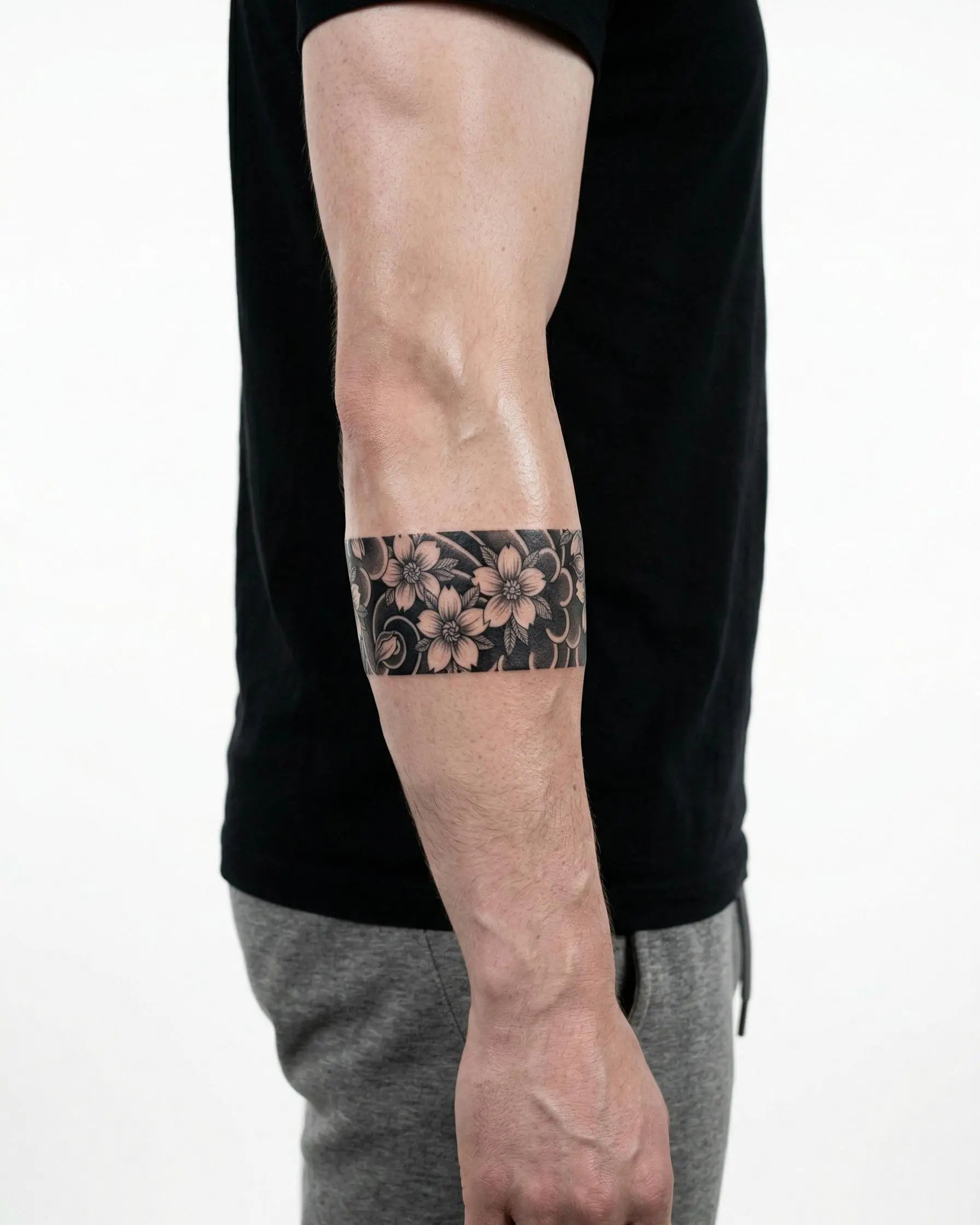 INKON Cherry Blossom Band semi-permanent tattoo applied on a man – 2 x 9 in (5x23cm) design, realistic ink look, lasts 10 days
