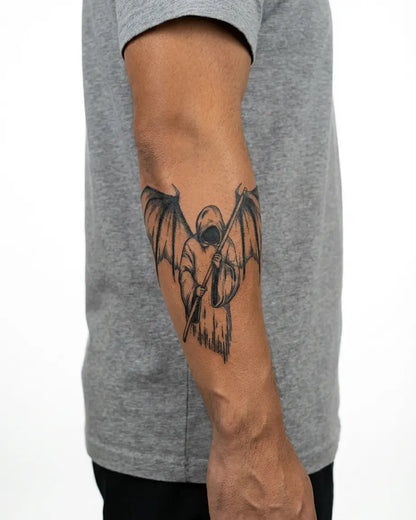 INKON Winged Reaper semi-permanent tattoo applied on a man – 4 x 7 in (10x17cm) design, realistic ink look, lasts 10 days
